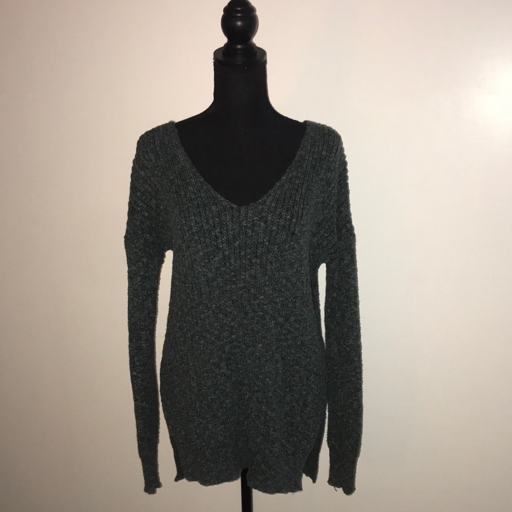 Teal long sleeved wool top.